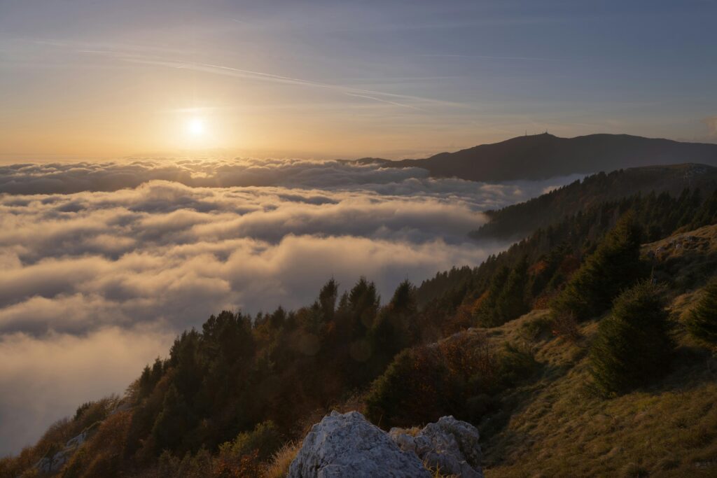 Thick morning fog covering rolling hills in Lambasingi